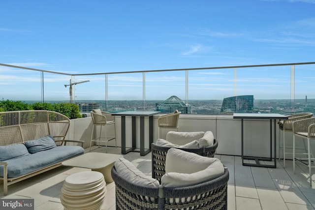 balcony featuring a view of city and outdoor lounge area