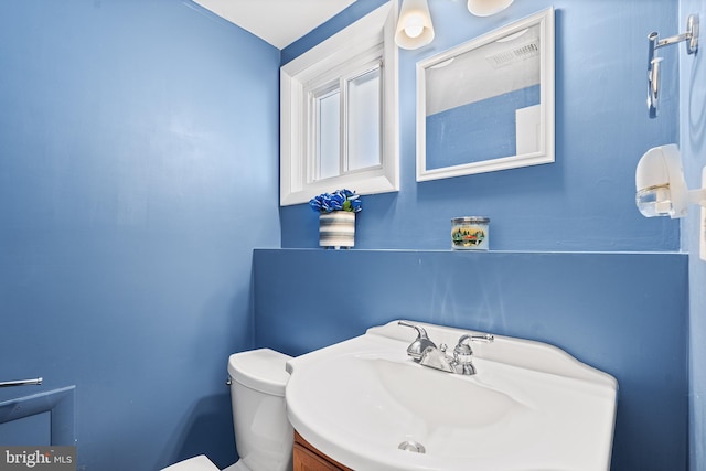 bathroom with sink and toilet