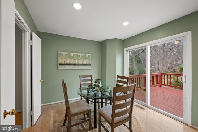 dining area featuring hardwood / wood-style floors