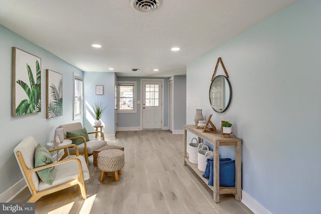 foyer entrance with light wood-type flooring