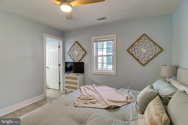 bedroom featuring ceiling fan and light hardwood / wood-style flooring