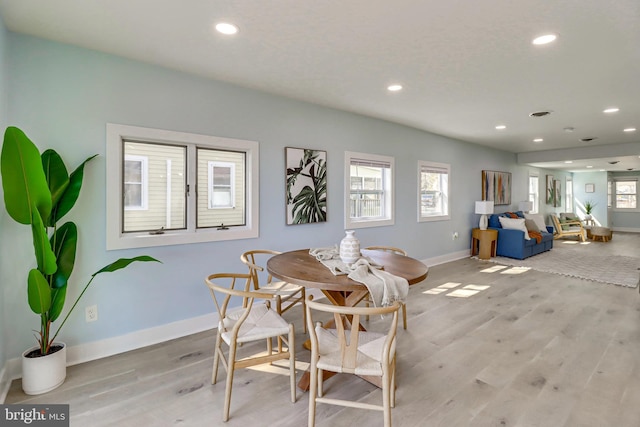 dining space featuring light wood-type flooring