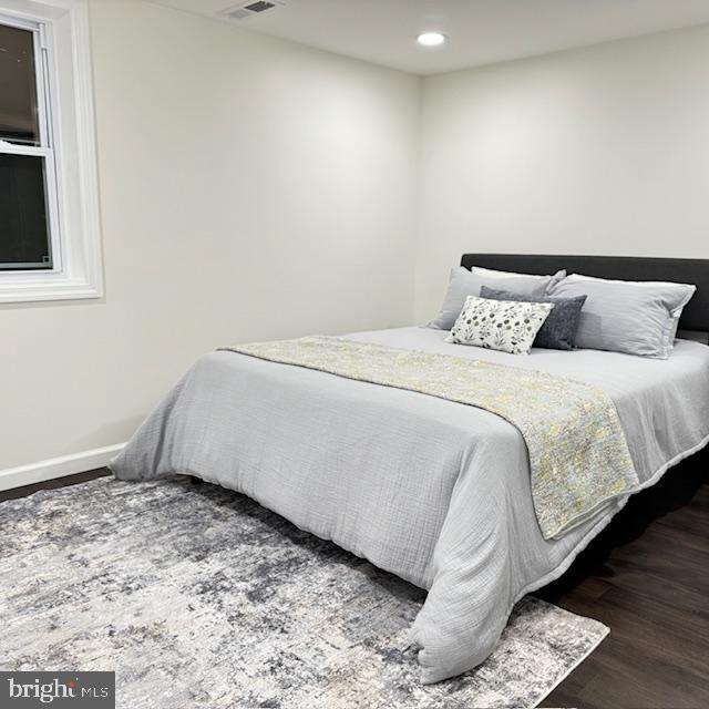 bedroom with wood-type flooring