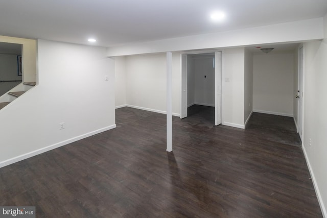 basement featuring dark hardwood / wood-style floors