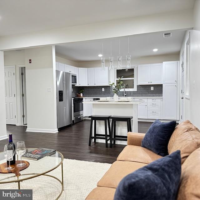 living room featuring dark hardwood / wood-style floors