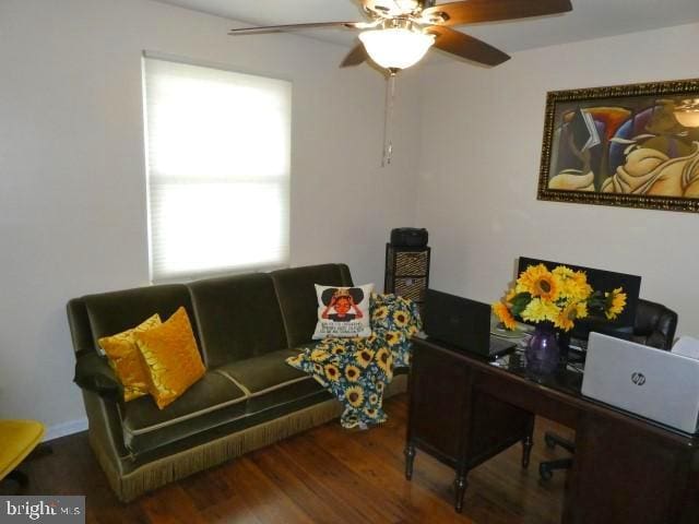 home office featuring ceiling fan and dark hardwood / wood-style floors