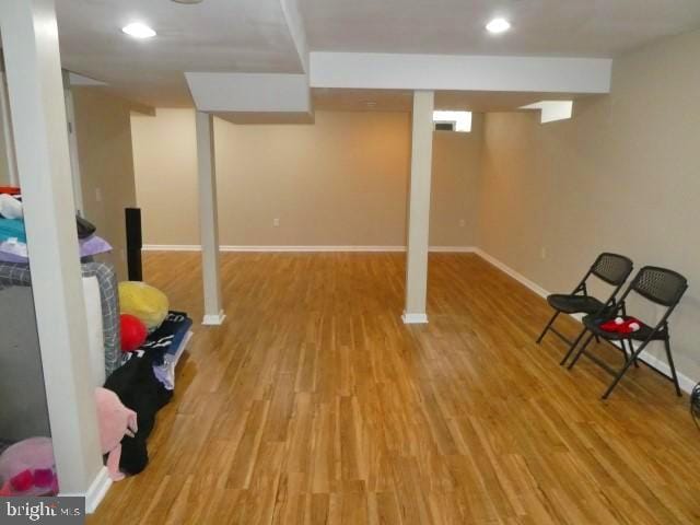 basement featuring light hardwood / wood-style flooring