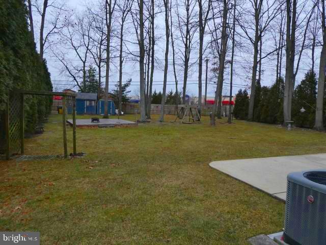 view of yard with a playground and cooling unit