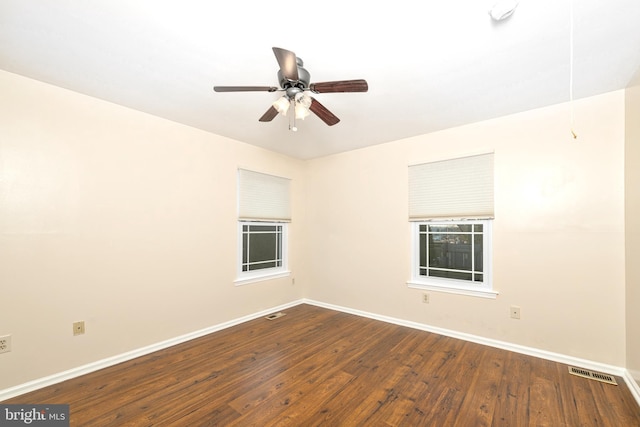 unfurnished room with ceiling fan and wood-type flooring