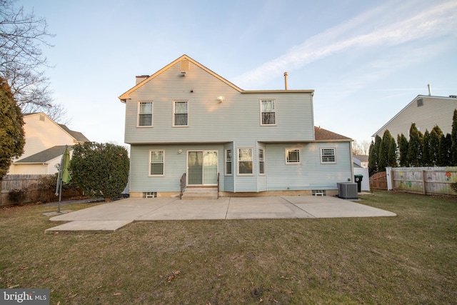 back of property featuring a patio, central AC unit, and a lawn