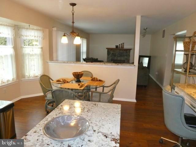 dining space with a chandelier and dark hardwood / wood-style floors