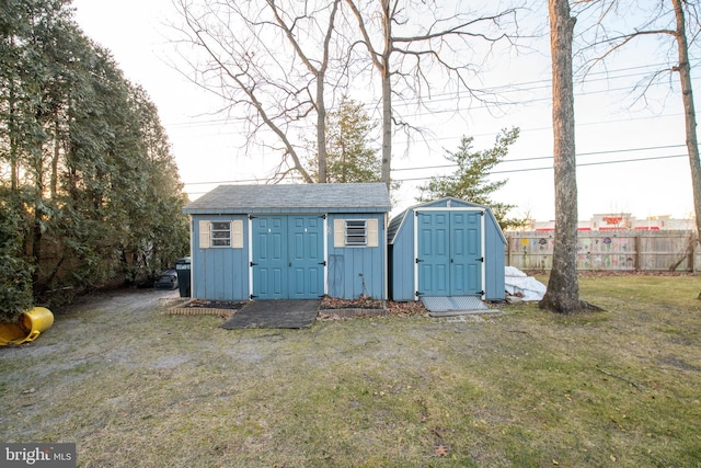 view of outbuilding featuring a yard