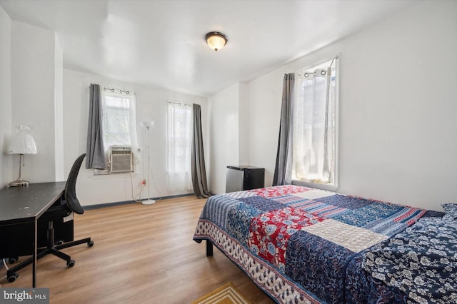 bedroom with hardwood / wood-style flooring