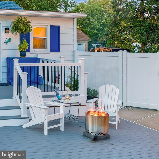 204 E Marengo, Saint Michaels, MD 21663 - wooden deck featuring a fire pit