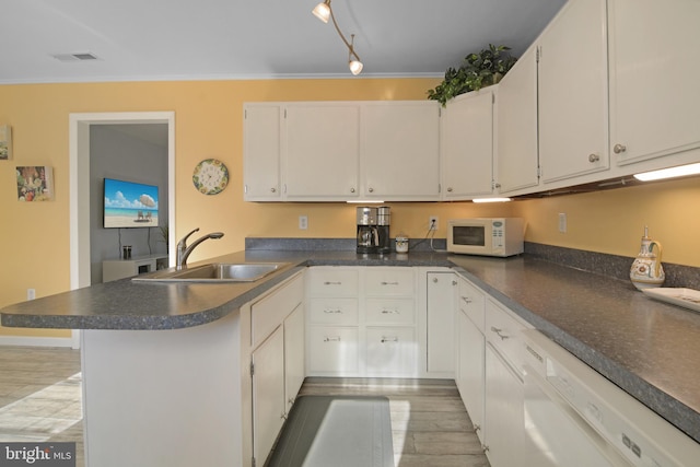 204 E Marengo, Saint Michaels, MD 21663 - kitchen with sink, crown molding, white appliances, light hardwood / wood-style flooring, and white cabinets