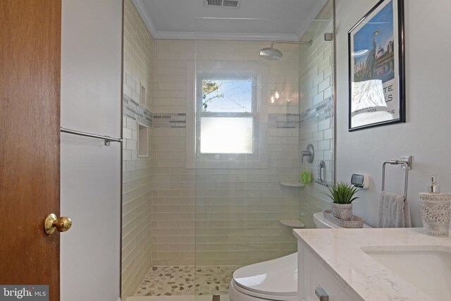 204 E Marengo, Saint Michaels, MD 21663 - bathroom featuring vanity, crown molding, a shower with shower door, and toilet