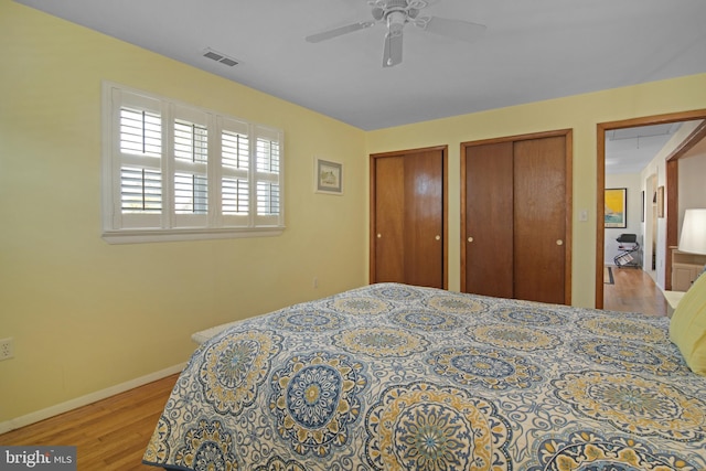 204 E Marengo, Saint Michaels, MD 21663 - bedroom featuring ceiling fan, light hardwood / wood-style floors, and two closets