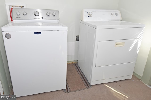 laundry room with laundry area and washer and clothes dryer