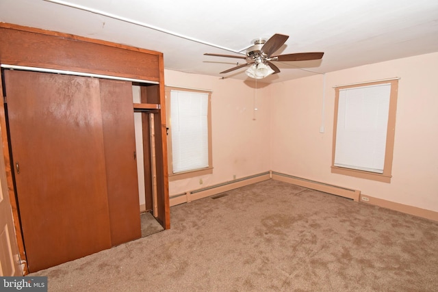 unfurnished bedroom featuring light carpet, ceiling fan, and a closet