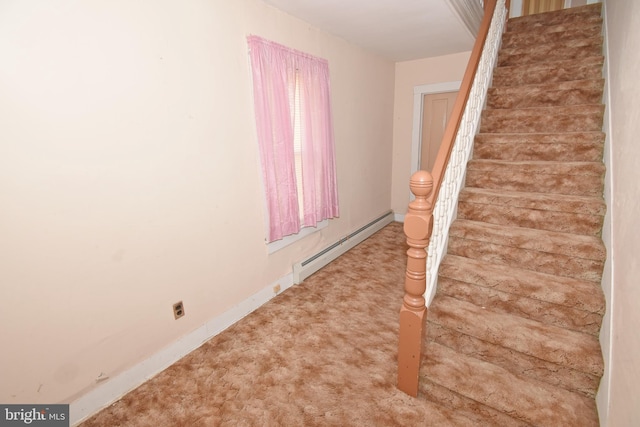 staircase featuring carpet floors, baseboards, and baseboard heating