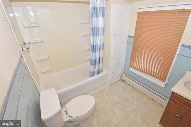 bathroom featuring shower / tub combo with curtain, tile walls, a baseboard heating unit, vanity, and tile patterned flooring