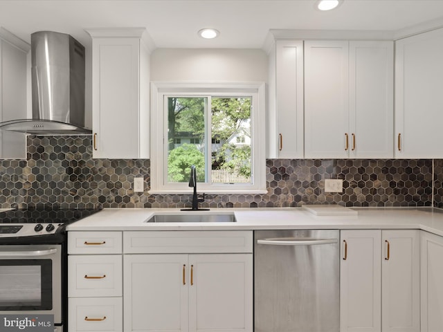 9301 Reef Ct, Alexandria, VA 22309 - kitchen featuring appliances with stainless steel finishes, wall chimney range hood, a sink, and white cabinets