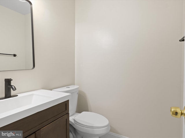 9301 Reef Ct, Alexandria, VA 22309 - half bathroom with toilet, vanity, and baseboards