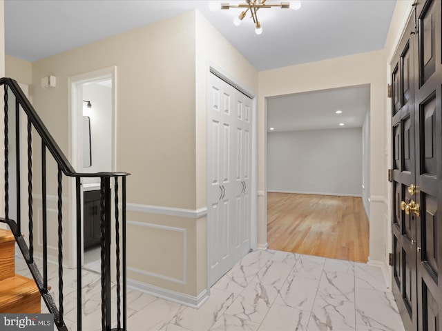 9301 Reef Ct, Alexandria, VA 22309 - foyer featuring light marble finish floors, stairs, baseboards, a chandelier, and recessed lighting
