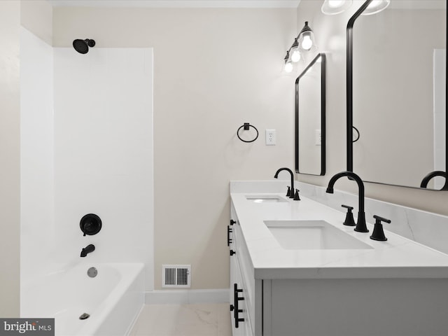 9301 Reef Ct, Alexandria, VA 22309 - full bathroom featuring marble look tiles,  shower combination, and double vanity