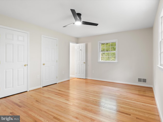 9301 Reef Ct, Alexandria, VA 22309 - unfurnished bedroom with light wood-style floors, baseboards, and a ceiling fan