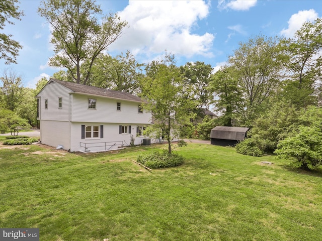 9301 Reef Ct, Alexandria, VA 22309 - back of property featuring a yard and central air condition unit