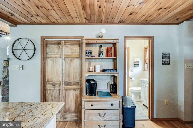 interior space with crown molding, wood-type flooring, wooden ceiling, and toilet