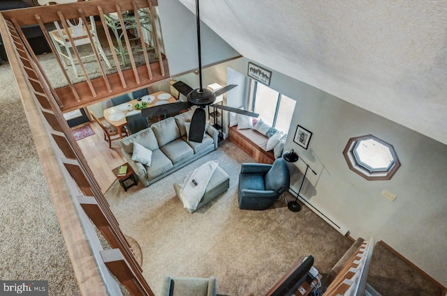 carpeted living room featuring lofted ceiling and a textured ceiling