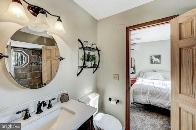 bathroom featuring vanity, toilet, and a wall mounted AC