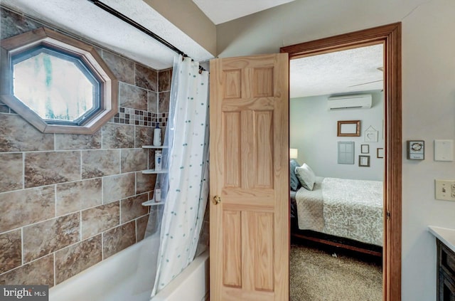 bathroom featuring shower / tub combo, vanity, an AC wall unit, and a textured ceiling