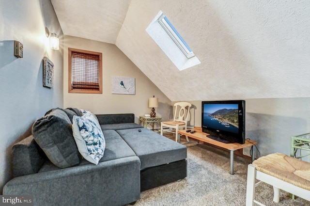 living room with lofted ceiling with skylight, a textured ceiling, and carpet