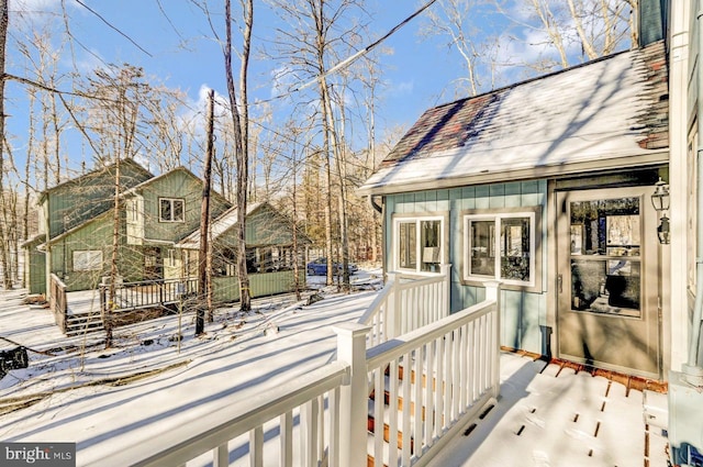 view of snow covered deck