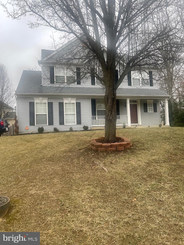 view of front of home with a front lawn and covered porch