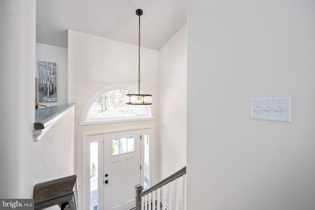 foyer entrance with a towering ceiling