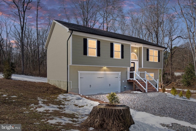 raised ranch featuring a garage