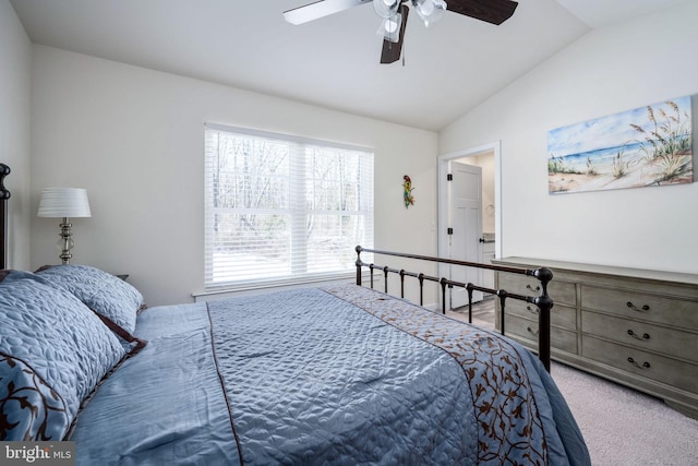 carpeted bedroom featuring lofted ceiling and ceiling fan