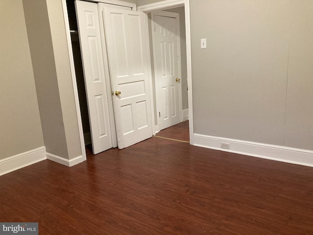 spare room featuring dark hardwood / wood-style floors