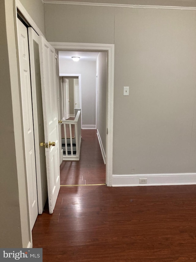 hall with dark wood-type flooring