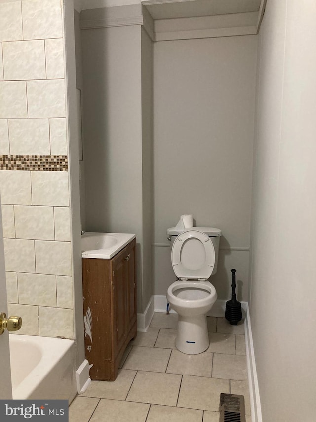 bathroom featuring tile patterned floors, toilet, and vanity