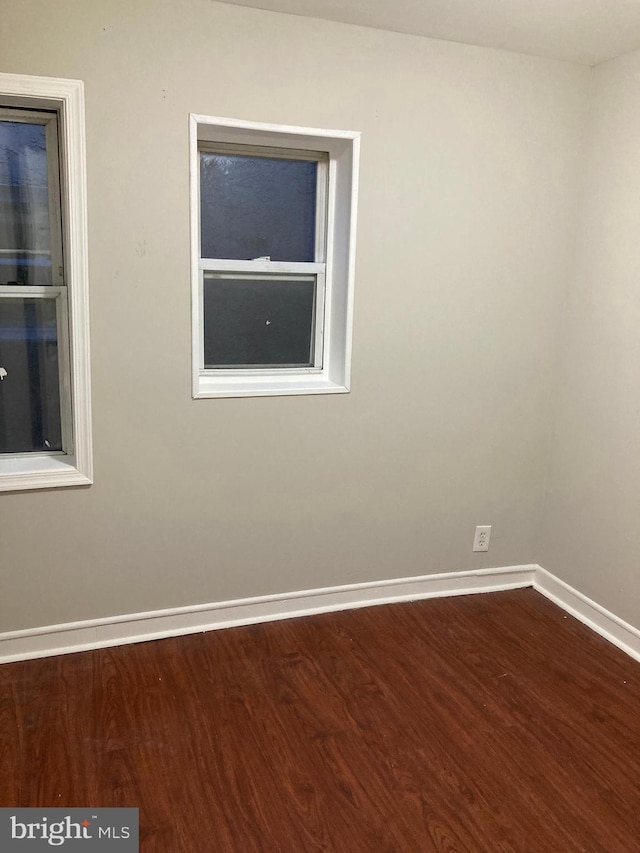 empty room featuring hardwood / wood-style flooring