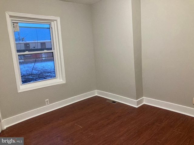 spare room with hardwood / wood-style floors