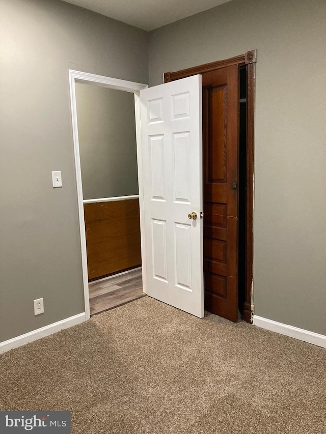 unfurnished bedroom with carpet flooring