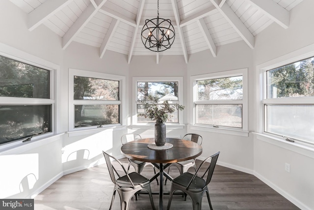 sunroom / solarium featuring a notable chandelier, wood ceiling, and lofted ceiling with beams