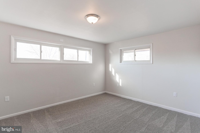 unfurnished room featuring carpet flooring