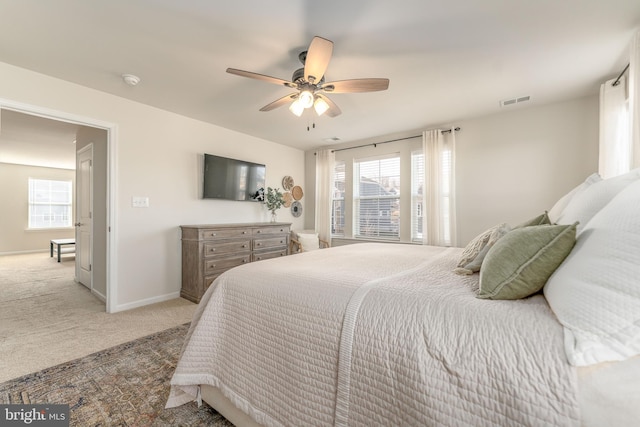 bedroom featuring carpet, visible vents, ceiling fan, and baseboards